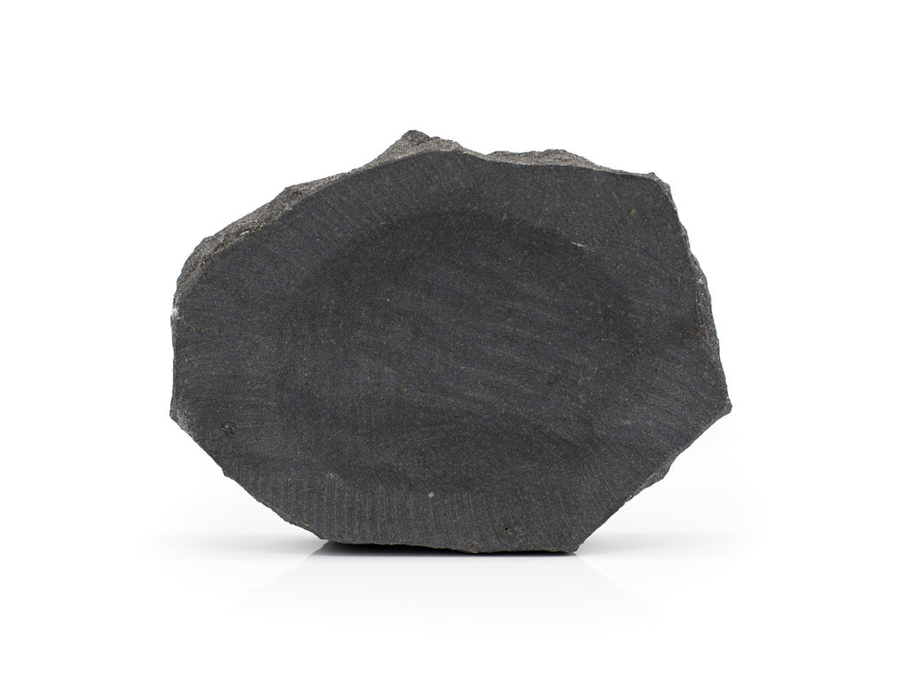 beautiful hand carved soap dish from Icelandic Basalt. Basalt rock is formed by solidification of magma and has columnar structure. Colour is dark grey or black. The soap dish only gets better with using it and it fits well under wet soap. We designed this beautiful hand carved soap dish from Icelandic Basalt to match our stone soap collection. (Blágrýti).